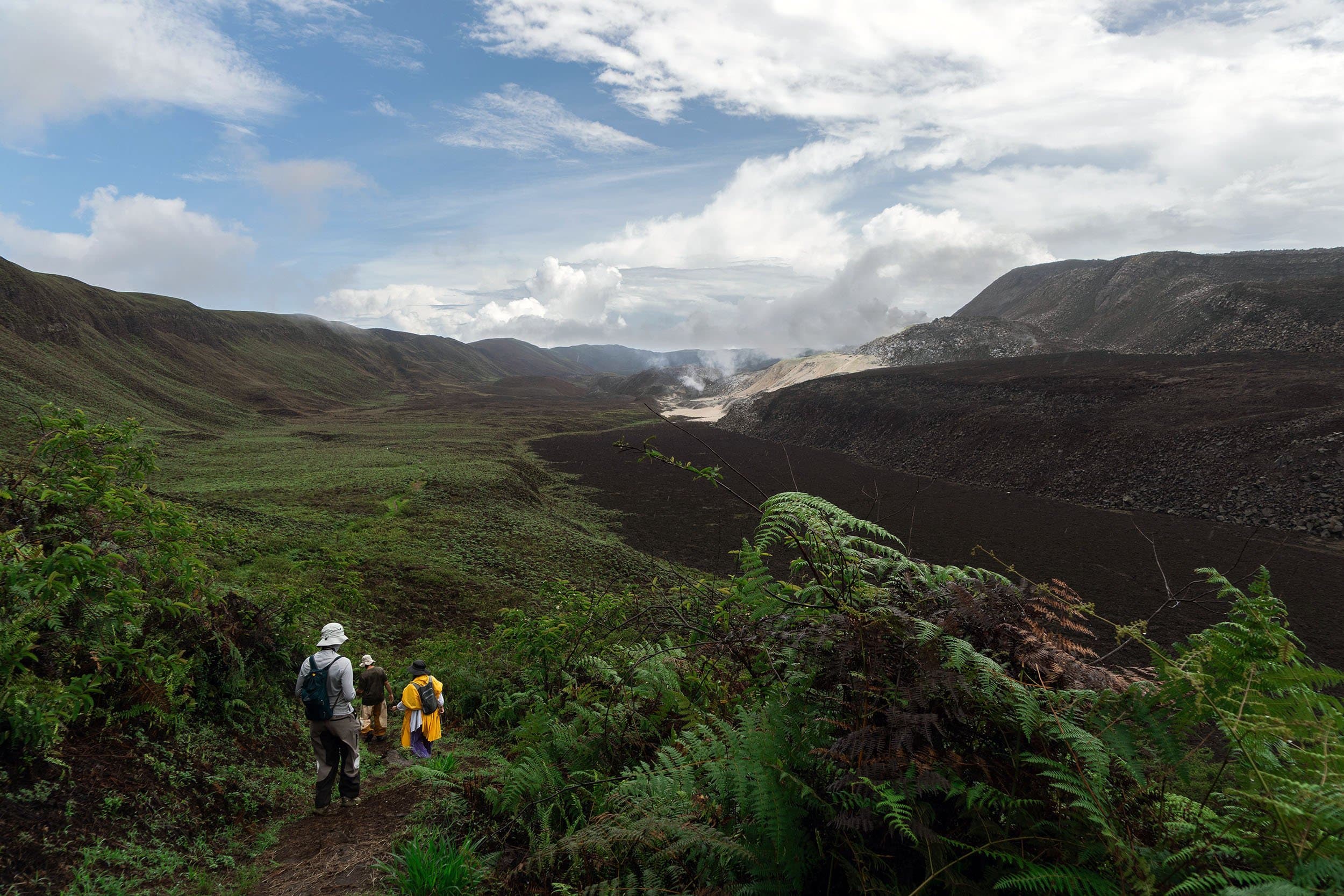 hikers exploring the caldera of a volcano