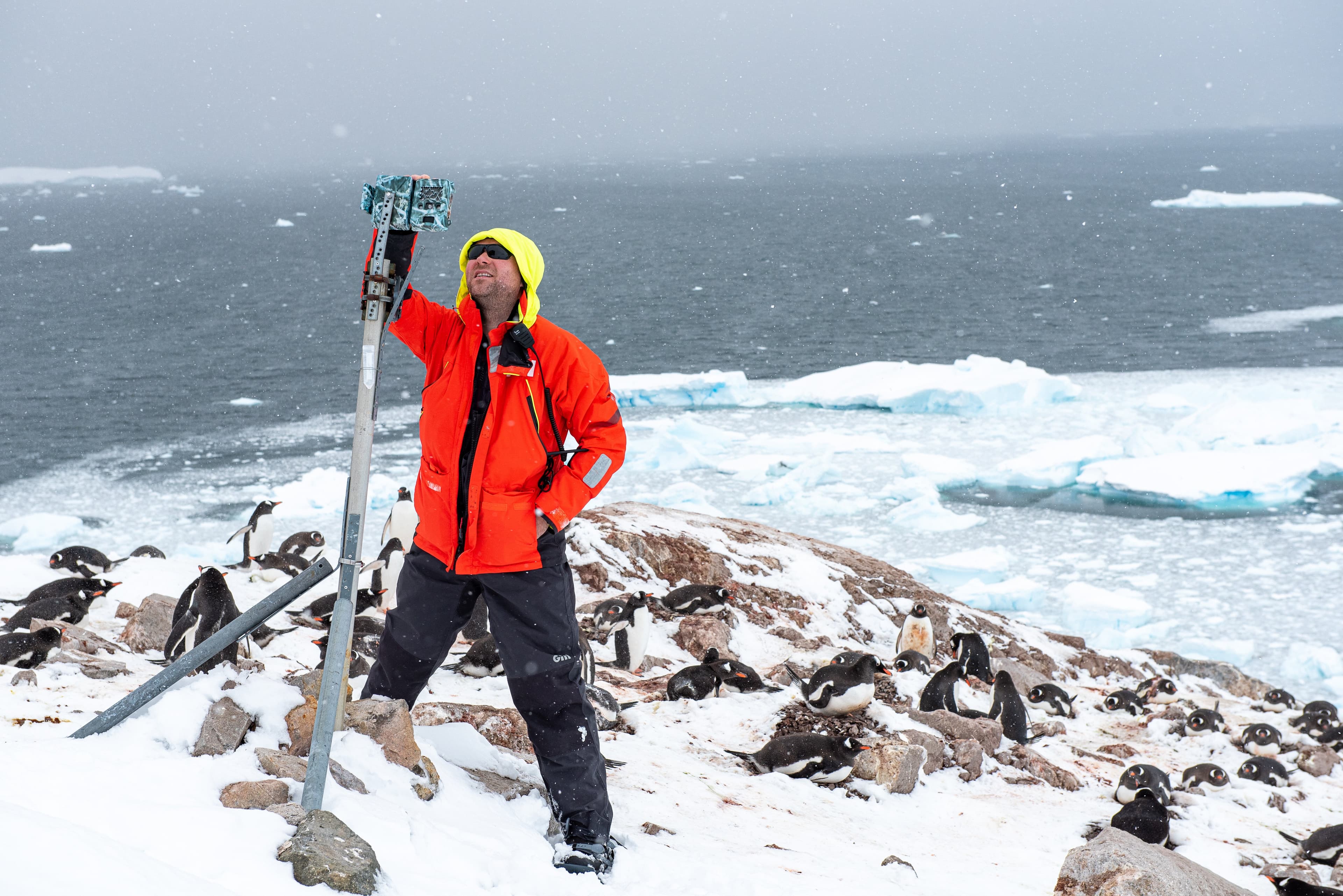 National Geographic Explorer and Visiting Scientist Tom Hart sets up a drone on Red Rock Ridge in Antarctica to aid in his penguin research.