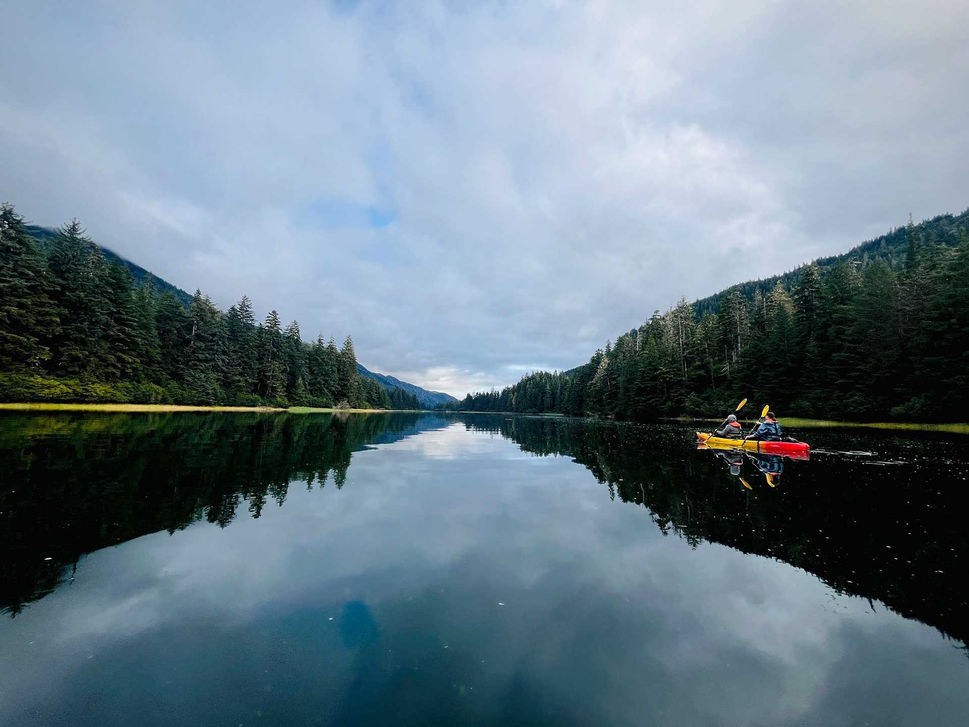 kayakers on glassy water