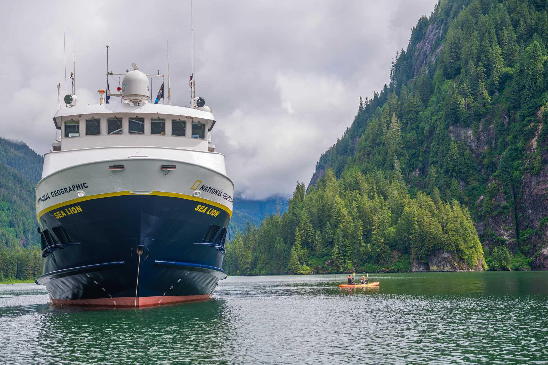 Guests explore by kayak from the ship National Geographic Sea Lion, Owl Pass in Rudyerd Bay, Misty Fiords National Monument, Ketchikan, Alaska.