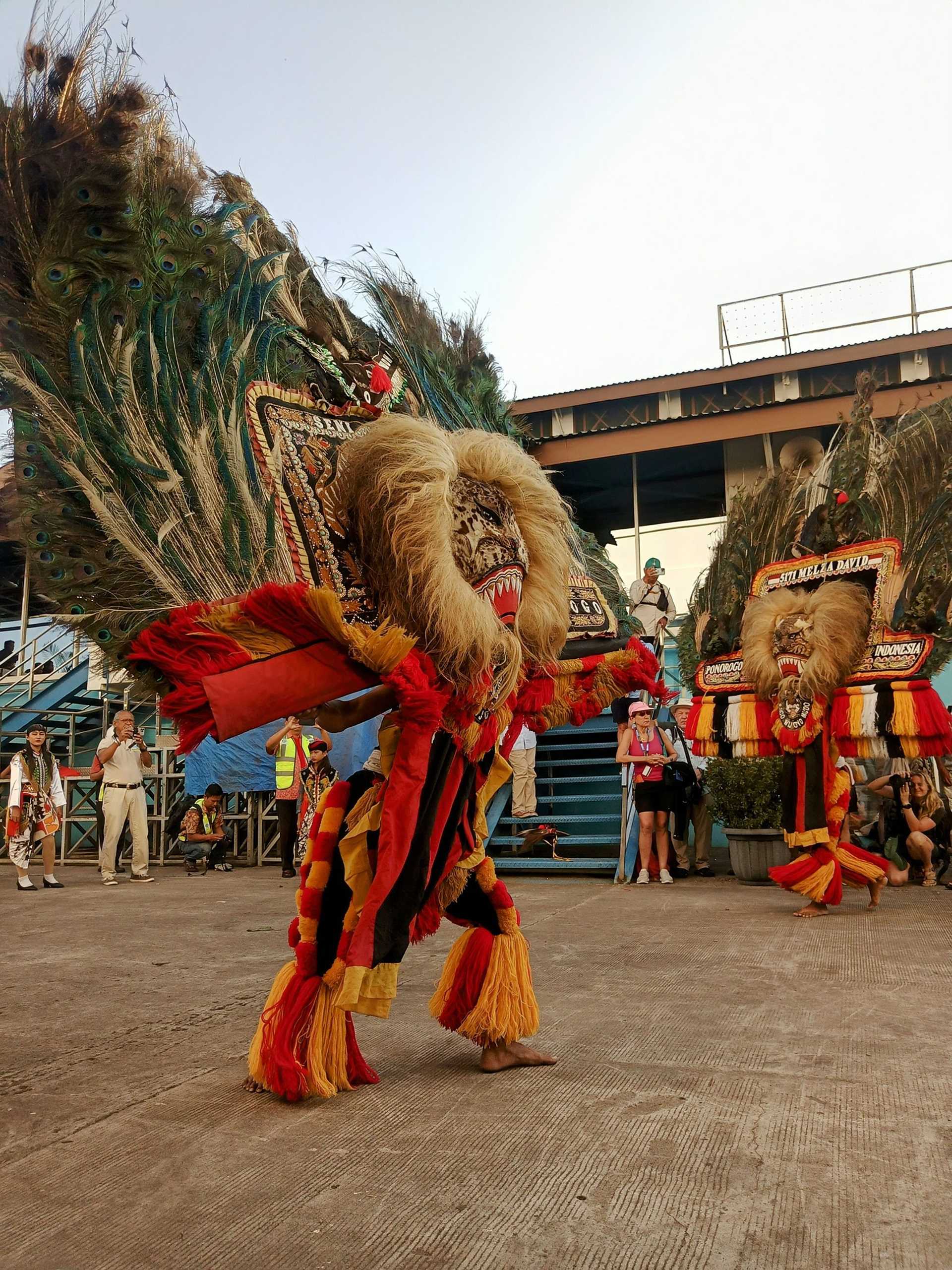 dancer in traditional orange costume