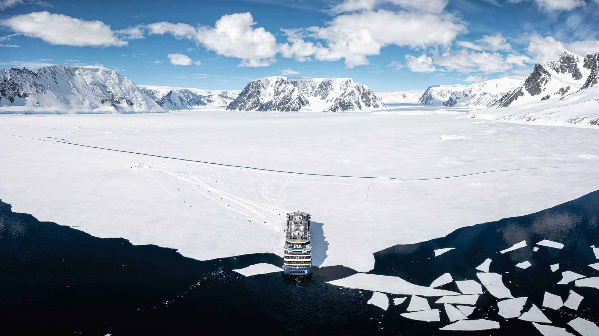 An aerial view of the National Geographic Endurance parked in pack ice.