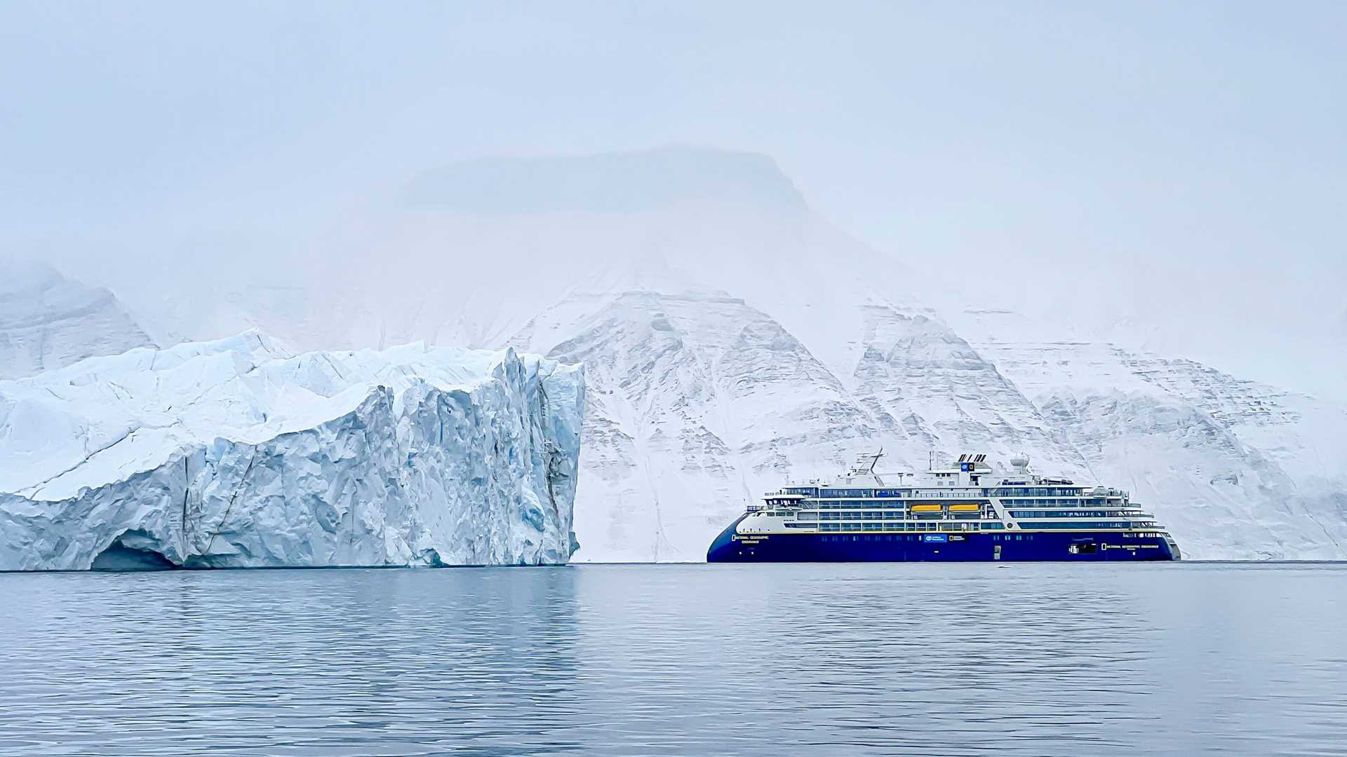 national geographic endurance in front of a glacier