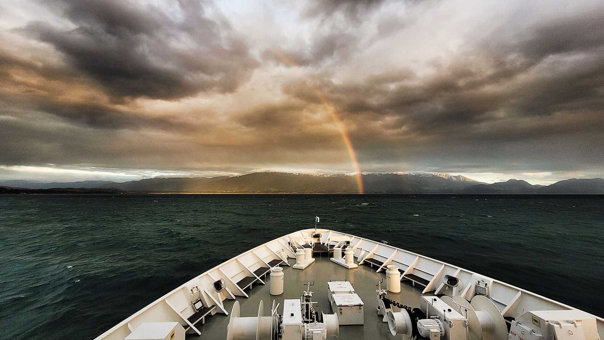 rainbow as seen from the bow of a ship