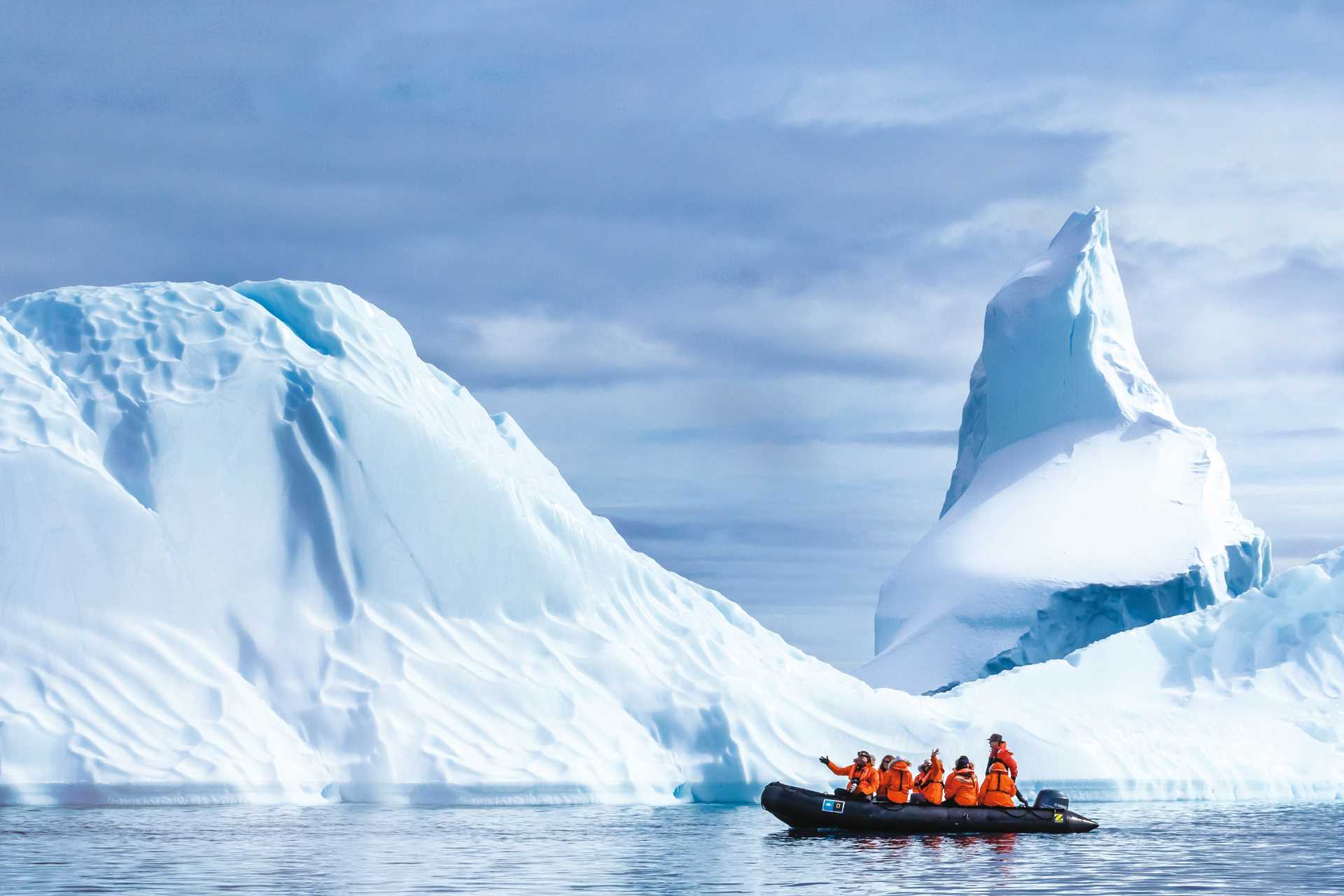 Six guests and a naturalist explore the glaciers off Booth Island by Zodiac.